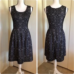 Dress with black lace overlay.